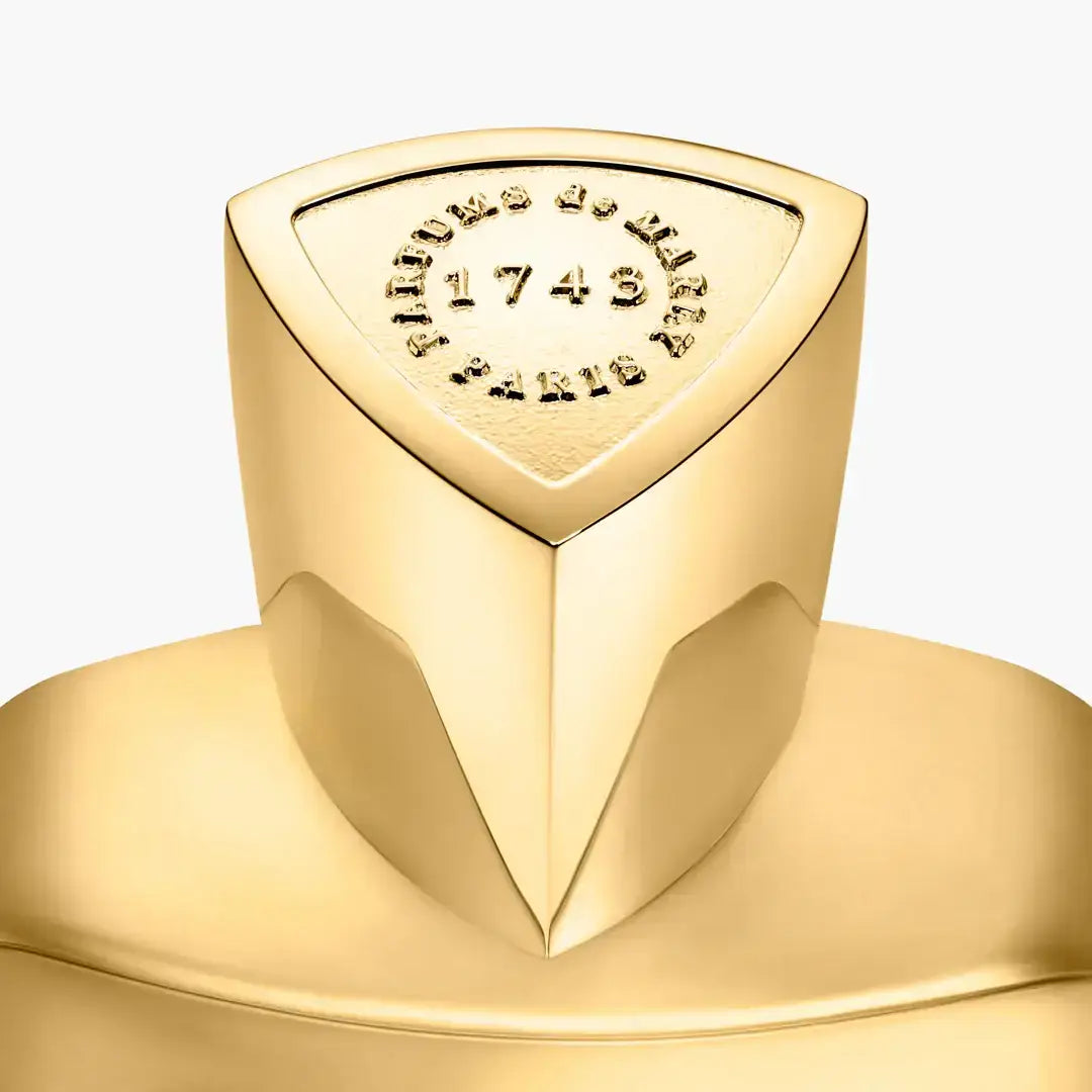 GODOLPHIN fragrance bottle featuring elegant golden design and embossed details, showcasing the essence of luxury.