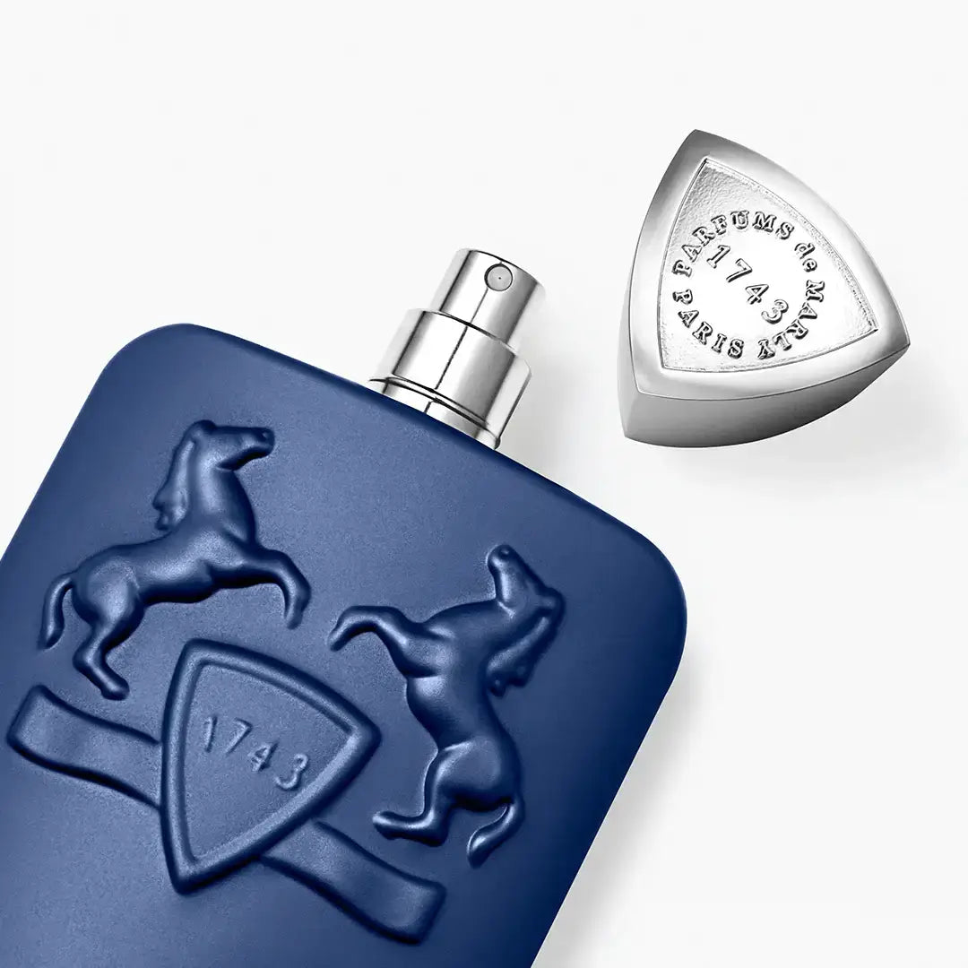 PERCIVAL by Parfums de Marly showcasing a blue bottle with a horse emblem and an elegant spray cap.